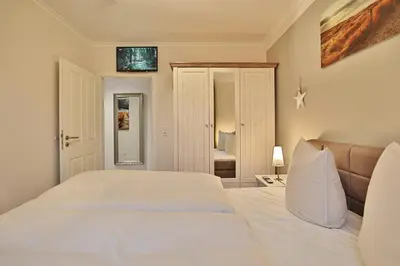 Ein Bett oder Betten in einem Zimmer der Unterkunft Domizil am Meer Domizil am Meer Appartement 14