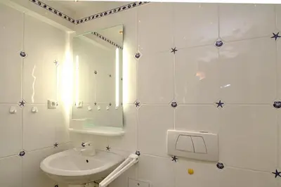 Ein Badezimmer in der Unterkunft Feriendomizil Birkenallee Feriendomizil Birkenallee Appartement 13