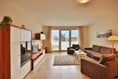 Ein Sitzbereich in der Unterkunft Villa Mér Baltique Villa Mér Baltique Appartement 20