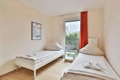 Ein Bett oder Betten in einem Zimmer der Unterkunft Domizil am Meer Domizil am Meer Appartement 07