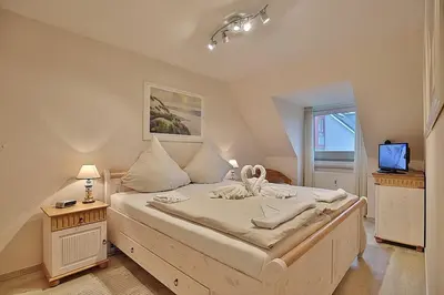 Ein Bett oder Betten in einem Zimmer der Unterkunft Domizil Strandburg Domizil Strandburg Appartement 26 Sonneneck