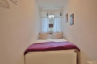 Ein Bett oder Betten in einem Zimmer der Unterkunft Domizil Strandallee 30 Domizil Strandallee 30 Appartement 01