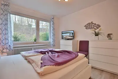 Ein Bett oder Betten in einem Zimmer der Unterkunft Domizil Strandallee 30 Domizil Strandallee 30 Appartement 01