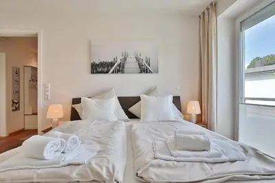 Ein Bett oder Betten in einem Zimmer der Unterkunft Die Wolburg Die Wolburg Appartement 8