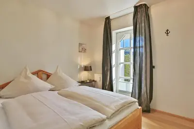 Ein Bett oder Betten in einem Zimmer der Unterkunft Am Rosenhain 12 Am Rosenhain 12 Appartement 1