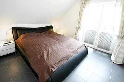 Ein Bett oder Betten in einem Zimmer der Unterkunft Villa Mare Villa Mare Appartement 4