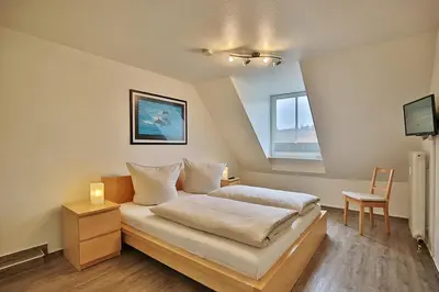 Ein Bett oder Betten in einem Zimmer der Unterkunft Ferienanlage Bergstraße 62 Ferienhaus Bergstraße 62 Appartement 17