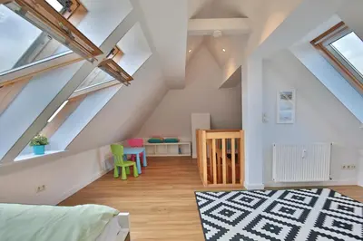 Ein Bett oder Betten in einem Zimmer der Unterkunft Maison Baltique Niendorf Ferienwohnung 