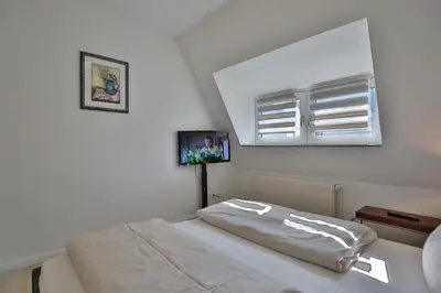 Ein Bett oder Betten in einem Zimmer der Unterkunft Haus Strandidyll Haus Strandidyll Haus 2