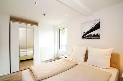 Ein Bett oder Betten in einem Zimmer der Unterkunft Residenz am Timmendorfer Platz Residenz am Timmendorfer Platz Appartement 3