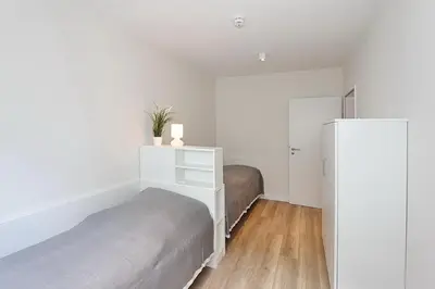 Ein Bett oder Betten in einem Zimmer der Unterkunft Villa Stern Villa Stern Appartement 06
