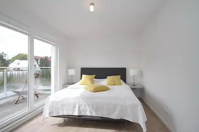 Ein Bett oder Betten in einem Zimmer der Unterkunft Ferienanlage Bergstrasse 6 Ferienanlage Bergstrasse 6 Appartement 7