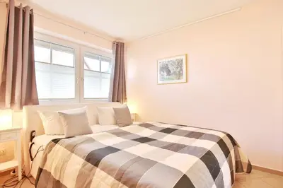 Ein Bett oder Betten in einem Zimmer der Unterkunft Gorch-Fock-Park Haus 57 Gorch-Fock-Park 57 Appartement 13
