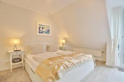 Ein Bett oder Betten in einem Zimmer der Unterkunft Wohnpark am Mühlenteich Wohnpark am Mühlenteich Appartement 34