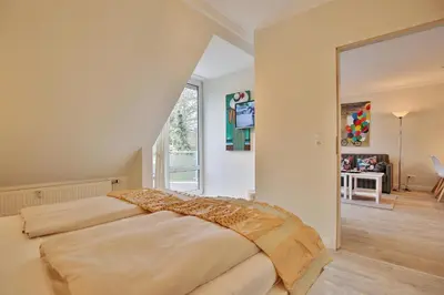 Ein Bett oder Betten in einem Zimmer der Unterkunft Wohnpark am Mühlenteich Wohnpark am Mühlenteich Appartement 34