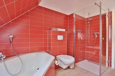 Ein Badezimmer in der Unterkunft Haus Bergstrasse 4 Haus Bergstraße 4 Appartement 9