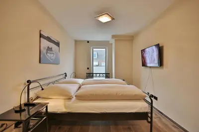 Ein Bett oder Betten in einem Zimmer der Unterkunft Logenplatz am Kammerweg Ostseetraum Appartement 7