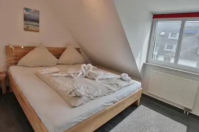 Ein Bett oder Betten in einem Zimmer der Unterkunft Hansa-Residenz I Hansa-Residenz I Appartement 15 Sonnentraum