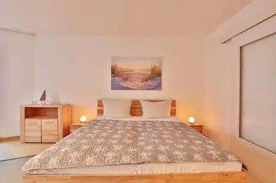 Ein Bett oder Betten in einem Zimmer der Unterkunft Strandburg Strandburg Appartement 2