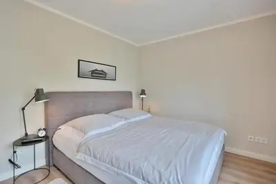 Ein Bett oder Betten in einem Zimmer der Unterkunft Hanseaten Residenz Hanseaten-Residenz Appartement 14