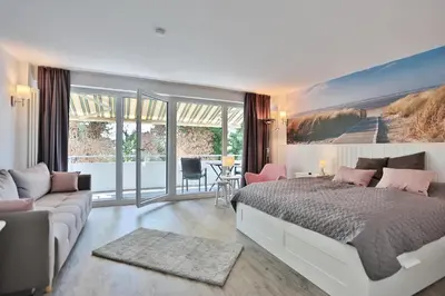 Ein Bett oder Betten in einem Zimmer der Unterkunft Strandhotel Scharbeutz Sweet little Beachside