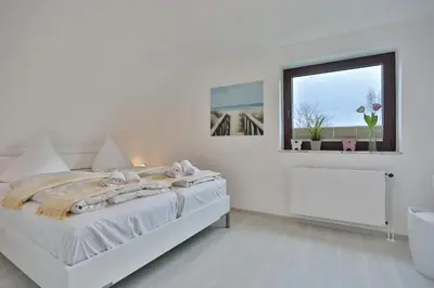 Ein Bett oder Betten in einem Zimmer der Unterkunft Residenz Strandnah Residenz Strandnah Haus
