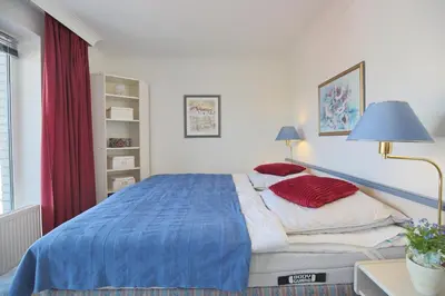 Ein Bett oder Betten in einem Zimmer der Unterkunft Strandschlößchen Strandschlösschen Appartement 28