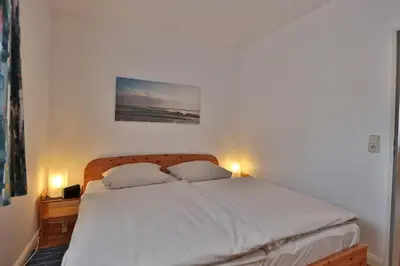 Ein Bett oder Betten in einem Zimmer der Unterkunft Strandburg Strandburg Appartement 11