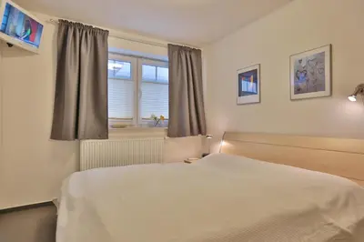 Ein Bett oder Betten in einem Zimmer der Unterkunft Strandvilla Strandvilla Appartement 18