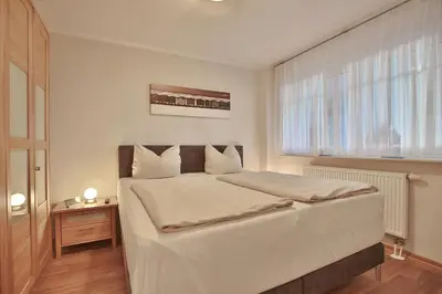 Ein Bett oder Betten in einem Zimmer der Unterkunft Strandvilla Strandvilla Appartement 3