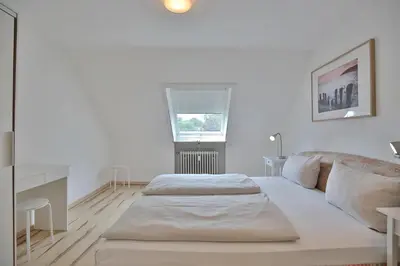 Ein Bett oder Betten in einem Zimmer der Unterkunft Haus am Ahornweg 2 Haus am Ahornweg 2C Appartement 7