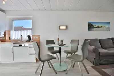 Ein Sitzbereich in der Unterkunft Strandperle Strandperle Appartement 101