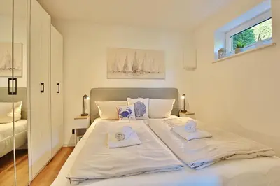 Ein Bett oder Betten in einem Zimmer der Unterkunft Haus am Nöltingsweg Haus am Nöltingsweg Appartement 08