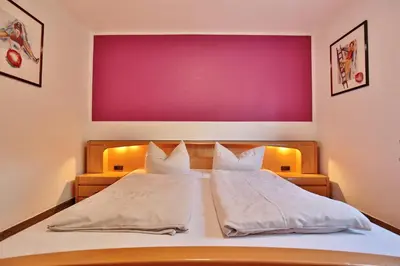 Ein Bett oder Betten in einem Zimmer der Unterkunft Parkresidenz Parkresidenz Appartement 2