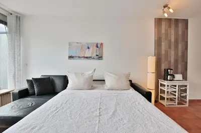 Ein Bett oder Betten in einem Zimmer der Unterkunft Haus Ludwigstraße Haus Ludwigstraße 27 Appartement 10