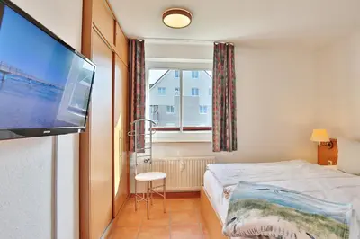 Ein Bett oder Betten in einem Zimmer der Unterkunft Witthus I Witthus I Neue Bergstrasse 7 Appartement 8
