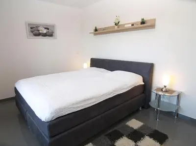 Ein Bett oder Betten in einem Zimmer der Unterkunft Strandglück Haus B Strandglück Appartement 12B