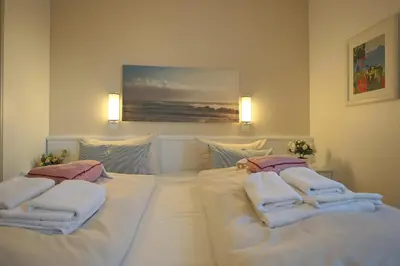 Ein Bett oder Betten in einem Zimmer der Unterkunft Ostseeblick Ostseeblick Appartement 4