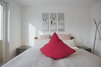 Ein Bett oder Betten in einem Zimmer der Unterkunft Strandglück Haus B Strandglück Appartement 9B