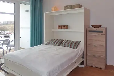 Ein Bett oder Betten in einem Zimmer der Unterkunft Strandglück Haus A Strandglück Appartement 19A
