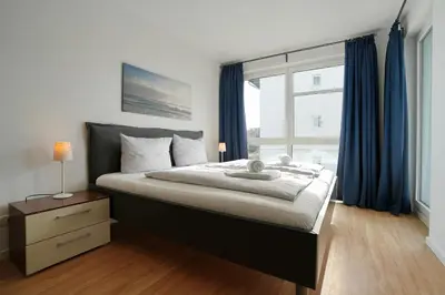 Ein Bett oder Betten in einem Zimmer der Unterkunft Strandglück Haus A Strandglück Appartement 19A