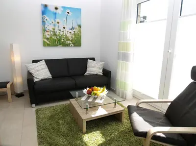 Ein Sitzbereich in der Unterkunft Strandglück Haus B Strandglück Appartement 4B