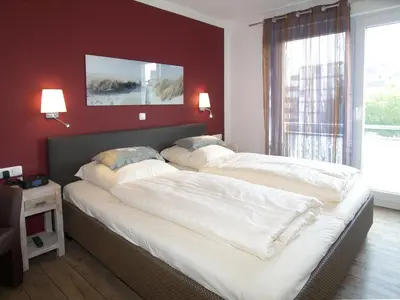 Ein Bett oder Betten in einem Zimmer der Unterkunft Strandglück Haus B Strandglück Appartement 15B
