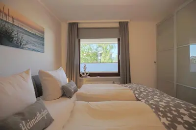 Ein Bett oder Betten in einem Zimmer der Unterkunft Haus Hansastrasse 13 Haus Hansastrasse Appartement HanSa Bay