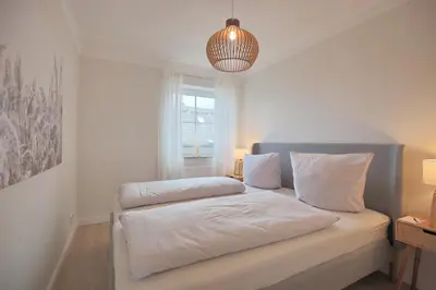 Ein Bett oder Betten in einem Zimmer der Unterkunft Residenz Alte Bergstraße Residenz Alte Bergstrasse Appartement 17