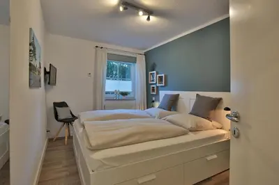 Ein Bett oder Betten in einem Zimmer der Unterkunft Residenz Alte Bergstraße Residenz Alte Bergstrasse Appartement 5