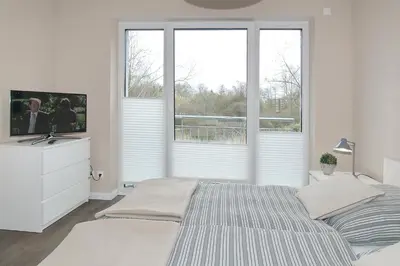 Ein Bett oder Betten in einem Zimmer der Unterkunft Kurparkresidenz Kurparkresidenz Appartement 13