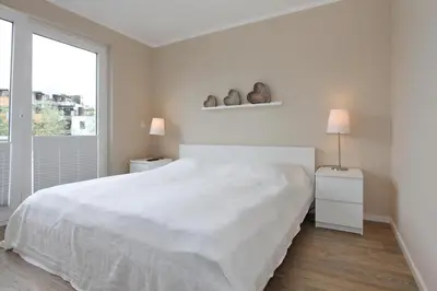 Ein Bett oder Betten in einem Zimmer der Unterkunft Strandglück Haus C Strandglück Buhne 11 Appartement 11C