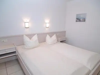 Ein Bett oder Betten in einem Zimmer der Unterkunft Parkresidenz Parkresidenz Appartement 6