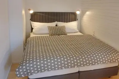 Ein Bett oder Betten in einem Zimmer der Unterkunft Gorch Fock Ring Strand und Meer Appartement 1